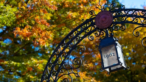 Rutgers 1902 gate against an autumn sky