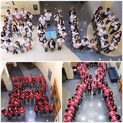 Group of students standing to form the word Bold