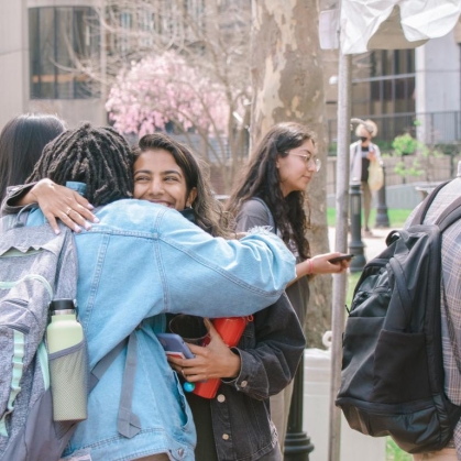Students greet each other during Rutgers Newark Involvement Fair.