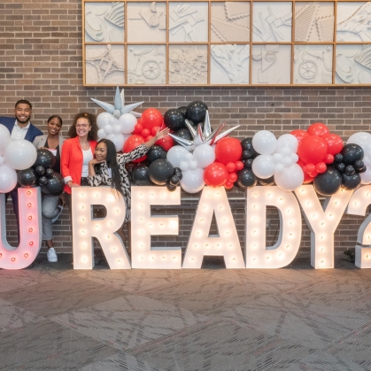 Minority Student Program students behind of R-U Ready Sign. 