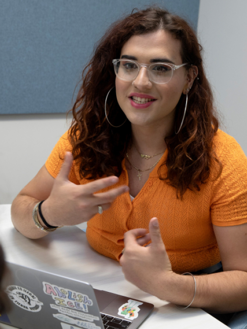 Rutgers student Yiraldo Campos talks to clients during RSSI internship