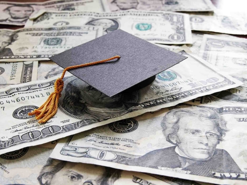 photo of money and graduation cap