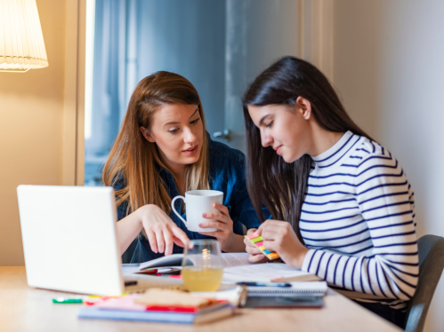 Parent helping student study